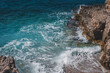 © olezzo - ea landscape, blue turquoise water and foamy wave in a rocky bay.
