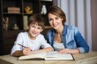 © Stavros's son - Mom helps son do homework sitting at table writing in paper notebook right answer