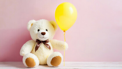 Smiling white teddy bear holding one yellow balloon on pink background with copy space