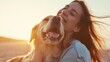 Woman in sheer delight hugging her golden retriever dog during a beautiful sunset