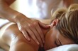 a woman getting a back massage at spa