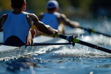 Close-up of two men paddling on a lake. Concept of rowing.