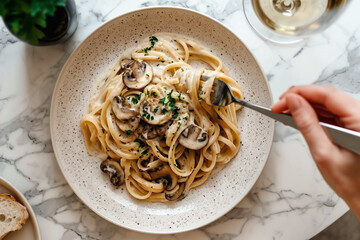 Wall Mural - Eating Mushroom pasta on a marble table