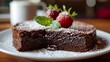 Swedish traditional chocolate cake Kladdkaka with fresh berries.. On a wooden table background.