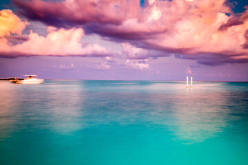 Wall Mural - amazing landscape with turquoise sea and pink sunset cloud