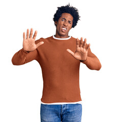 Canvas Print - Handsome african american man with afro hair wearing casual clothes afraid and terrified with fear expression stop gesture with hands, shouting in shock. panic concept.