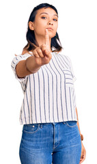 Wall Mural - Young woman wearing casual clothes pointing with finger up and angry expression, showing no gesture