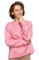 Sticker - Young hispanic woman wearing casual clothes looking confident at the camera smiling with crossed arms and hand raised on chin. thinking positive.