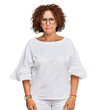 © Krakenimages.com - Beautiful middle age mature woman wearing casual clothes and glasses skeptic and nervous, frowning upset because of problem. negative person.