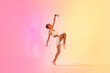 © Prostock-studio - An exuberant young dancer in a dynamic pose captures the essence of movement and grace
