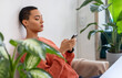© Prostock-studio - Serious calm young latin lady typing on smartphone, chat in social networks