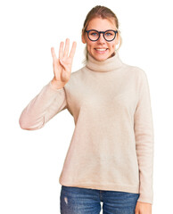 Wall Mural - Young beautiful blonde woman wearing turtleneck sweater and glasses showing and pointing up with fingers number four while smiling confident and happy.