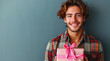 happy handsome man holds red and pink gift box, valentine's day on blue