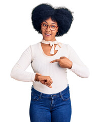 Poster - Young african american girl wearing casual clothes and glasses in hurry pointing to watch time, impatience, upset and angry for deadline delay