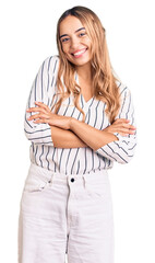 Wall Mural - Young beautiful blonde woman wearing casual clothes happy face smiling with crossed arms looking at the camera. positive person.