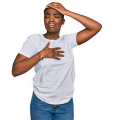 Poster - Young african american woman wearing casual white t shirt touching forehead for illness and fever, flu and cold, virus sick