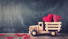 Photo Of Wooden Toy Truck With Hearts In Front Of Chalkboard Valentine S Day Celebration Concept Vintage Filtered