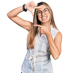 Poster - Hispanic young woman wearing casual white shirt smiling making frame with hands and fingers with happy face. creativity and photography concept.