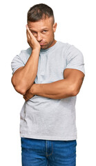 Sticker - Handsome muscle man wearing casual grey tshirt thinking looking tired and bored with depression problems with crossed arms.