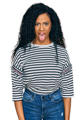 Sticker - Middle age african american woman wearing casual clothes sticking tongue out happy with funny expression. emotion concept.