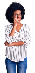 Sticker - Young african american woman wearing casual clothes and glasses looking stressed and nervous with hands on mouth biting nails. anxiety problem.