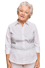 Wall Mural - Senior grey-haired woman wearing casual clothes smiling looking to the side and staring away thinking.