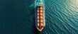 Bulk carrier ship visually observed at sea anticipating entrance to port, Aerial perspective.