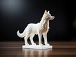 White 3d printed wolf figurine on a table with black background, studio shot