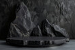 © NaphakStudio - Black geometric marble rock and stone shapes for background, Stone wall black space podium mockup, minimal presentation, 3d rendering.