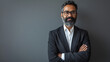 © l1gend - Proud confident bearded indian business man investor, rich ethnic ceo, corporate executive, professional lawyer banker, male office employee standing isolated on gray with arms crossed. Portrait