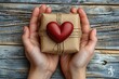 © Vasiliy - First person top view photo of girl's hands holding craft paper Valentine's day gift box