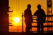 © CStock - Silhouette of two engineers on working site ,Construction site with beautiful sunset