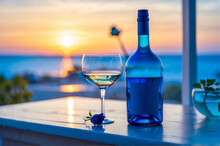 Photo Of Blue Wine Bottles And White Roses By The Window 2