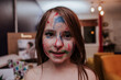 Elementary aged girl with marker all over her face