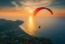 A Red Paraglider Flies At Sunset Against The Backdrop Of A Beautiful Sea Coastline Landscape