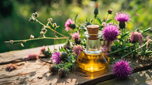 Milk Thistle Oil On A Table In The Garden. Selective Focus.