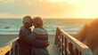 Sharing a romantic moment at the beach. Rearview of a happy senior couple touching their foreheads together on a seaside bridge.