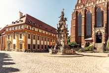 Poland, LowerSilesianVoivodeship, Wroclaw,Statue Of John Of Nepomuk In Front Of Collegiate Church Of Holy Cross And St Bartholomew