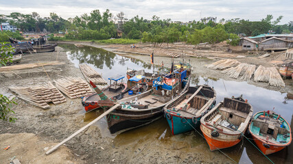 Wall Mural - Scenic landscape view of boats and rafts of bamboo on river bank, Maheshkhali island, Cox's Bazar, Bangladesh