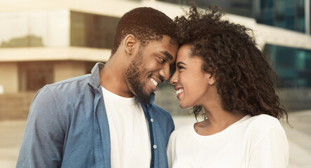 Wall Mural - Tender couple touching foreheads, bonding to each other