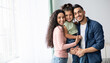 © Prostock-studio - Portraif Of Happy Arabic Parents Posing With Their Little Daughter At Home