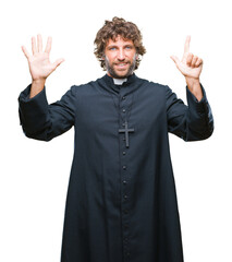 Poster - Handsome hispanic catholic priest man over isolated background showing and pointing up with fingers number seven while smiling confident and happy.