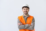 Fototapeta  - Young construction workers in hard hats and hamlet on a white background