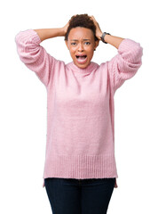 Canvas Print - Beautiful young african american woman over isolated background Crazy and scared with hands on head, afraid and surprised of shock with open mouth