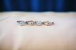 © altitudevisual - engagement rings lined up on velvet