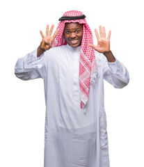 Wall Mural - Young arabic african man wearing traditional keffiyeh over isolated background showing and pointing up with fingers number nine while smiling confident and happy.