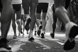 © Fotograf - A black and white photo capturing a group of people running. Suitable for various applications