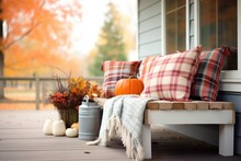 Plaid Blankets On Porch Bench With Autumn Farmhouse Backdrop