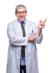 Wall Mural - Handsome senior doctor, scientist professional man wearing white coat over isolated background with a big smile on face, pointing with hand and finger to the side looking at the camera.