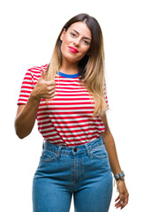 Sticker - Young beautiful woman casual look over isolated background doing happy thumbs up gesture with hand. Approving expression looking at the camera with showing success.